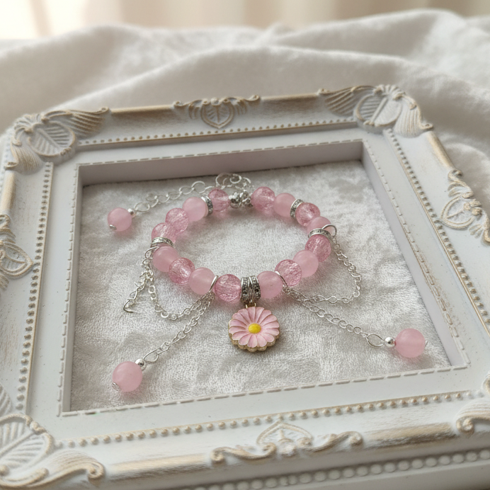 Decorative jewelry box with a pink bracelet on a soft white background