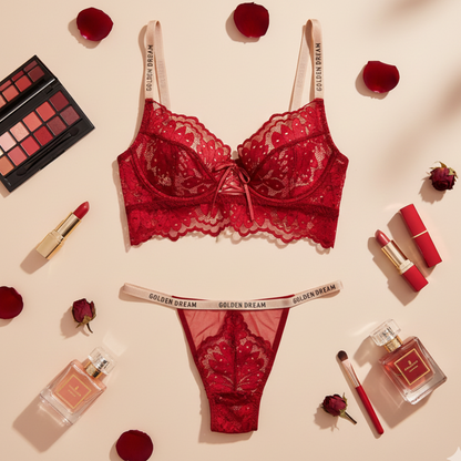 Red lace lingerie set with makeup and perfume on a beige background