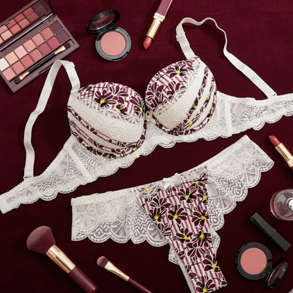 Lace lingerie set with makeup items on a dark red background