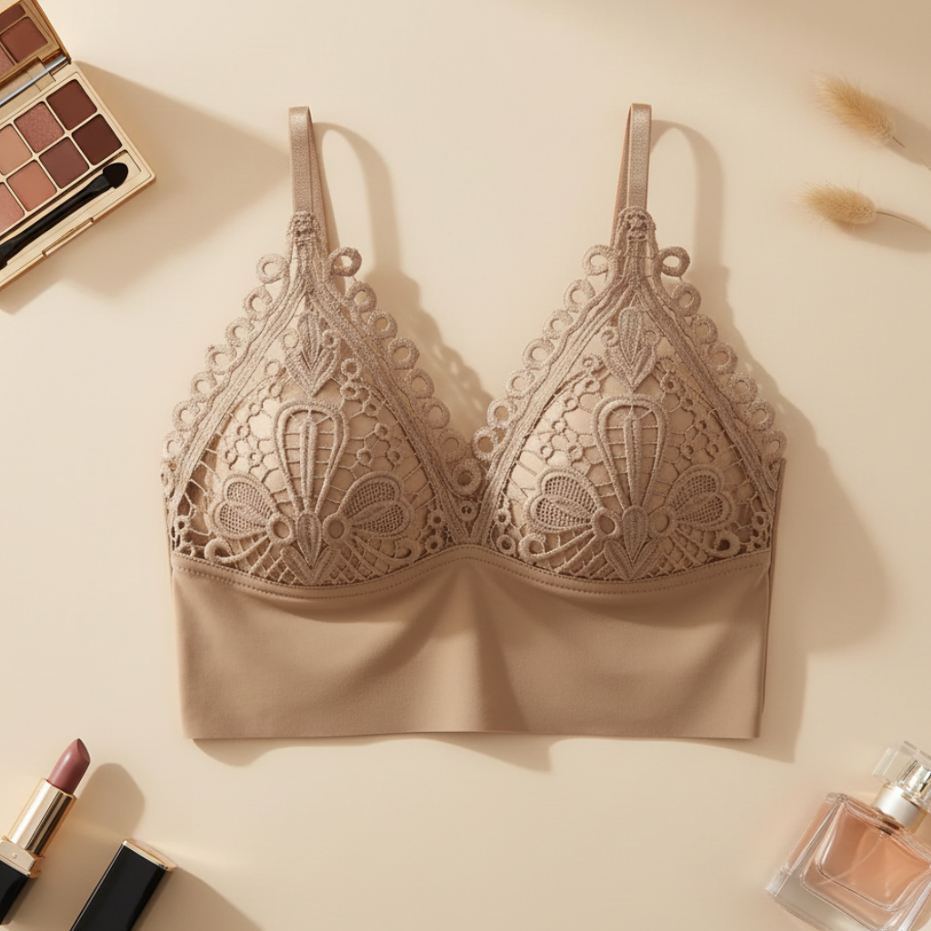 Beige lace bralette on a beige background with makeup items around