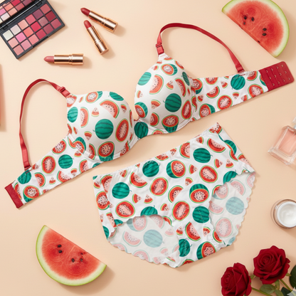 Watermelon-patterned bra and panties set with makeup and watermelon slices on a beige background
