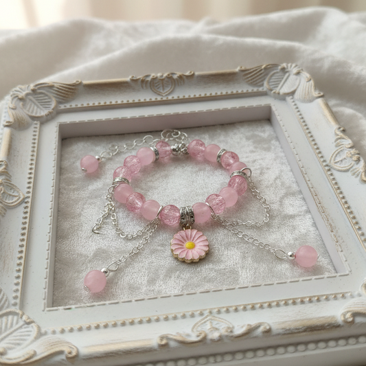 Decorative jewelry box with a pink bracelet on a soft white background